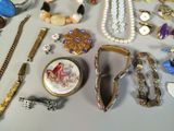 many different types of jewelry on the table