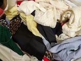 a pile of clothes that is sitting in a box
