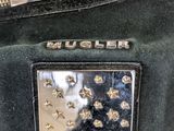 a black purse with a silver buckle on it