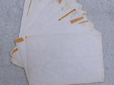 a close up of a pile of old papers on a table
