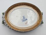 a plate with a picture of a man on it on a table
