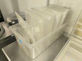 a lot of plastic containers that are on the kitchen counter