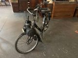 a bicycle that is parked in a garage