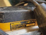 a drill on a table with a cord attached to it