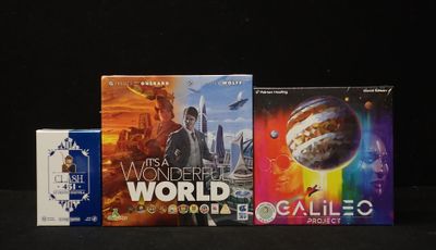 three books that are sitting on a table