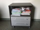 a filing cabinet with a drawer full of files