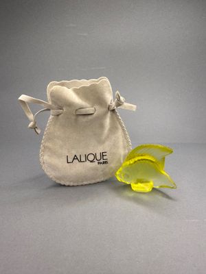 a small bag with a yellow flower inside of it