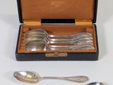 four spoons and two spoons in a case