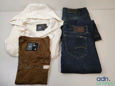 two pairs of jeans and a hoodie on a white table