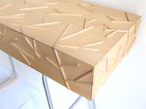 a wooden table with a metal base and a wooden box on it
