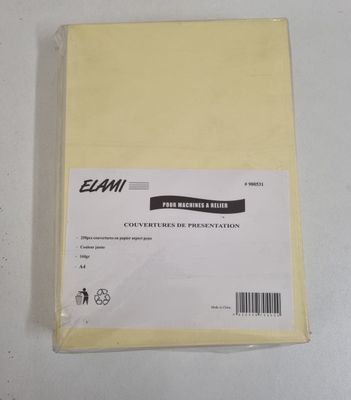 a piece of yellow paper sitting on top of a white table