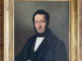 portrait of a man in a black coat and a white shirt