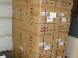 boxes stacked on top of each other in a storage room