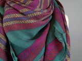 a green and purple scarf on a mannequin mannequin mannequin mannequin mannequin mannequin mannequin mannequin mann