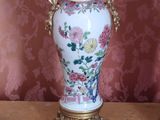 two vases that are sitting on a table