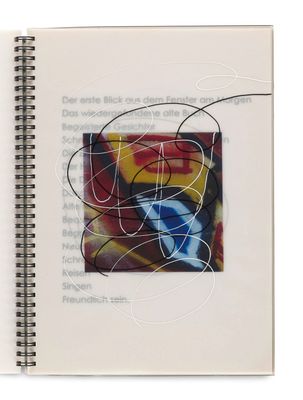 an open book with a drawing of a bird on it