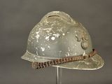 a helmet on a stand with a chain around it