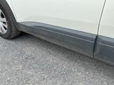 a white car parked on the side of the road
