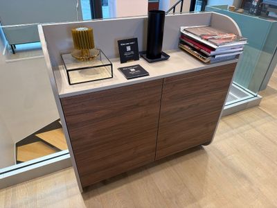 a coffee maker on a counter in the middle of a room