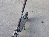 a scooter that is sitting on the pavement
