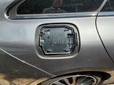 a car that has a broken door handle on the side of it