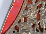 a silver and red box with a picture of a man and a woman on it