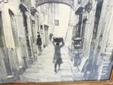 a black and white photo of a child holding an umbrella