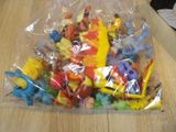 a plastic bag full of toy animals on a table