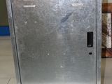 a metal cabinet sitting on a tile floor in a room