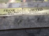 a sign that says frank dale limited on the side of a building