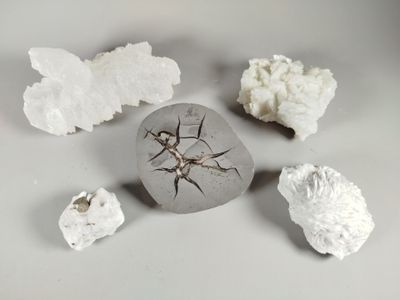 a rock with a crack in the middle of it surrounded by other rocks