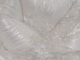 a plastic chair that is wrapped in plastic wrap