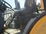 a tractor that is sitting in the dirt
