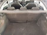 the back of a car with its trunk open and the seats down