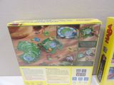 two boxed toys that are sitting on a table