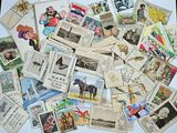 a pile of old postcards that are on a table