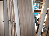 several pieces of wood are stacked on top of each other in a room