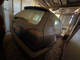 a dirty car that is parked in a garage