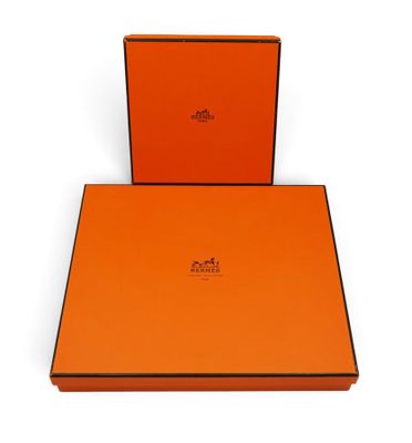a pair of orange boxes with black trims on a white background
