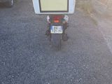 a motorcycle with a tv on the back of it