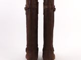 the back view of a pair of brown boots on a white background