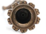 a close up of a metal object on a white surface