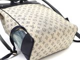 a purse that is sitting on a white surface