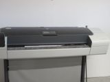 an image of a printer on a stand in a room