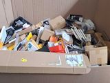a cardboard box full of assorted items in a room