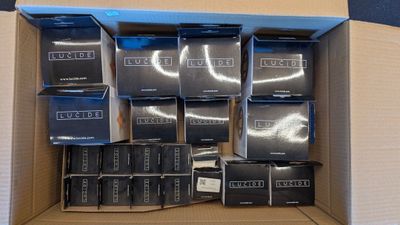 a cardboard box full of boxes of different sizes and colors