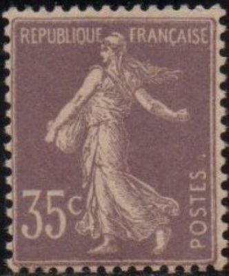 a stamp with a woman on it on a black background