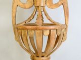 a wooden lamp that is on a white surface