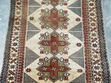 a rug with a pattern on it sitting on a floor
