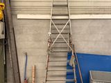 a ladder that is leaning against a wall in a garage